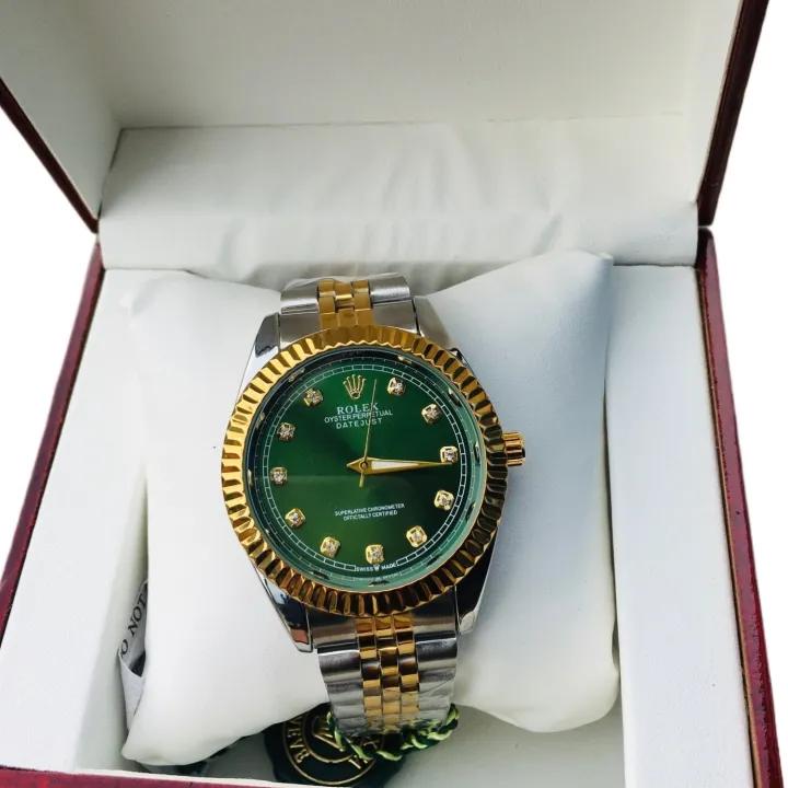 Rolex Datejust with a green diamond dial, gold fluted bezel, and a two-tone (gold & stainless steel) Jubilee bracelet.