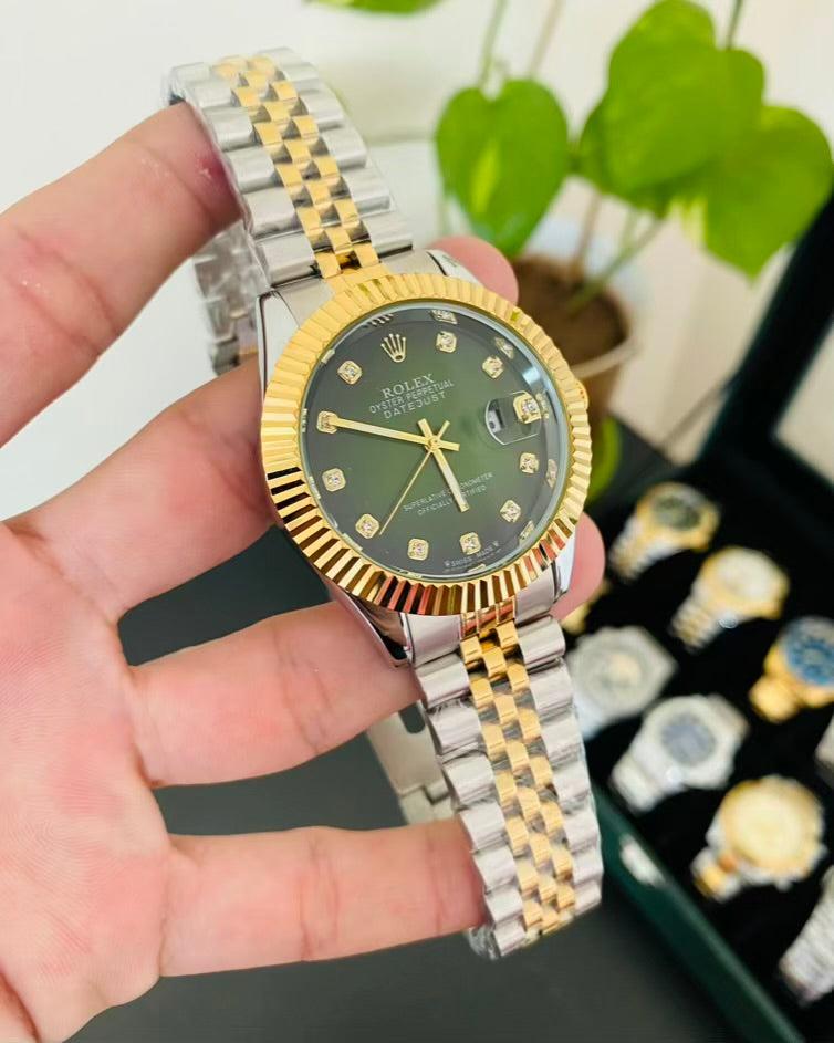 Rolex Datejust with a green diamond dial, gold fluted bezel, and a two-tone (gold & stainless steel) Jubilee bracelet.